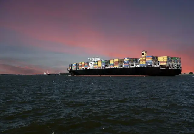 Fully loaded cargo ship on the ocean